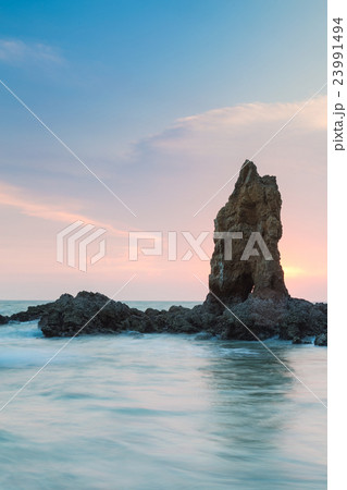 Sea and rock at the sunset 23991494