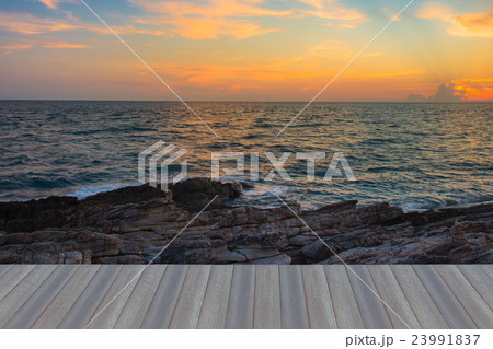 Sunset sky over seacoast with natural rock Sunset sky over seacoast with natural rock 23991837