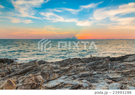 Natural rock with seacoast and beautiful sky Natural rock with seacoast and beautiful sky 23993286