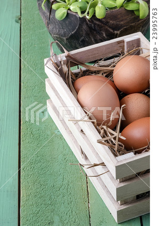 eggs in wooden box,eggs of hen in nature. eggs in wooden box,eggs of hen in nature. 23995763