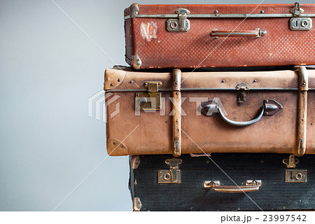 Vintage Ancient Suitcases Shabby Gray Background Vintage Ancient Suitcases Shabby Gray Background 23997542