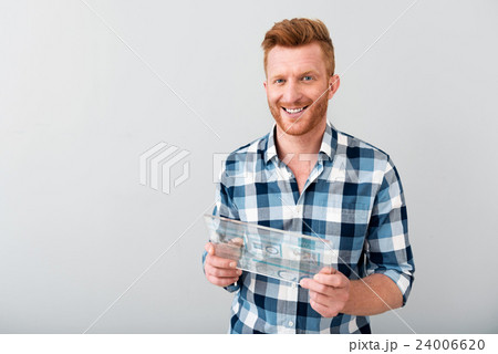 Positive man using tablet 24006620