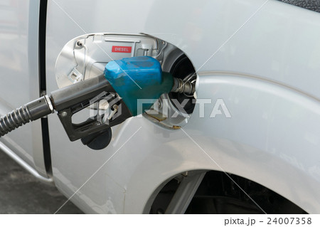 Fuel nozzle to add fuel in car at gas station 24007358