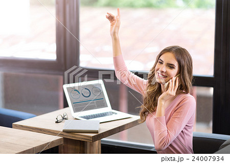 Joyful woman talking on cell phone 24007934