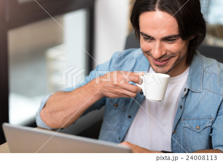 Positive man drinking coffee Positive man drinking coffee 24008113