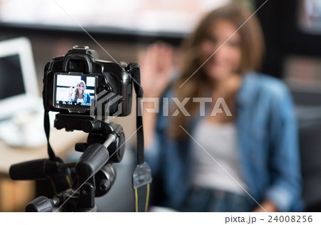 Pleasant woman sitting on the couch Pleasant woman sitting on the couch 24008256