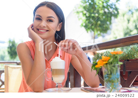 Cute smiley woman resting in cafe Cute smiley woman resting in cafe 24009522