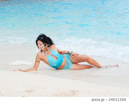 nice girl at the azure tropical beach 24011389