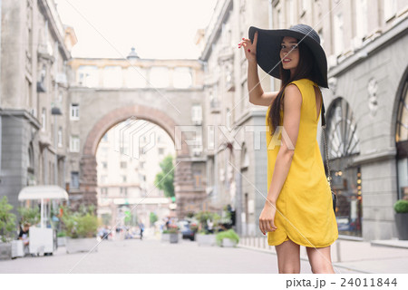 Carefree woman relaxing in town 24011844