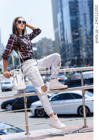 Pretty girl resting in city Pretty girl resting in city 24012202