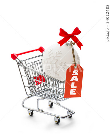 Shopping cart with big Christmas ball Shopping cart with big Christmas ball 24012488