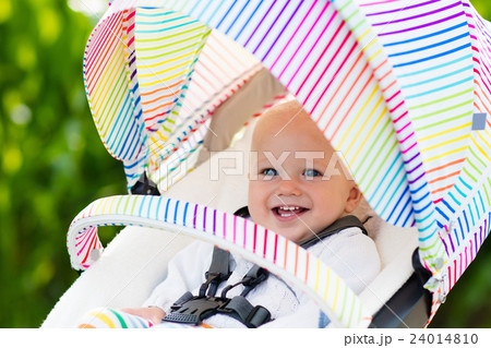 Baby in white stroller 24014810