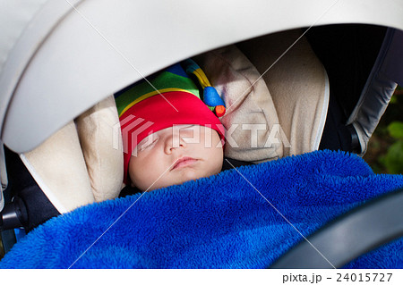 Baby sleeping in a stroller 24015727