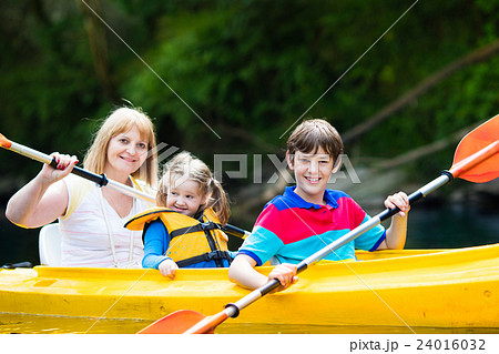 Family enjoying kayak ride on a river Family enjoying kayak ride on a river 24016032