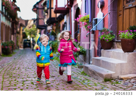 Children in historical city center in France Children in historical city center in France 24016333