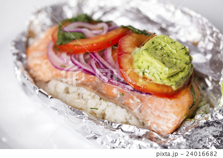 red fish baked in foil with rice, onion, oil pesto 24016682