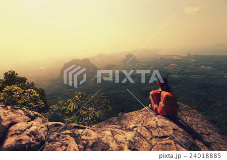 young woman backpacker hiking on mountain peak young woman backpacker hiking on mountain peak 24018885