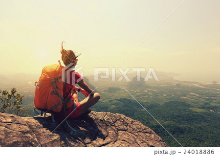 young woman backpacker hiking on mountain peak young woman backpacker hiking on mountain peak 24018886
