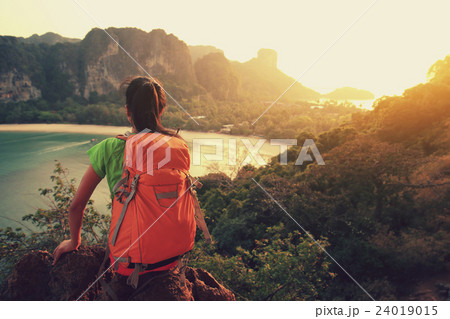 young woman enjoy the view on mountain peak young woman enjoy the view on mountain peak 24019015