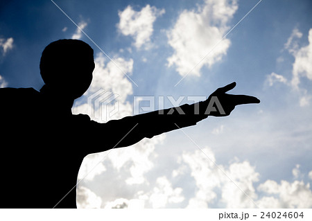 Silhouette of businessman with Go gesture in sky 24024604