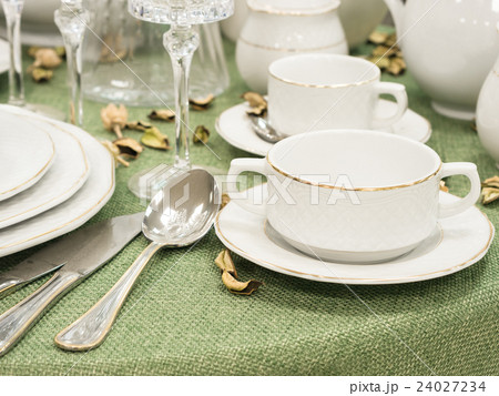 Set of dishes on table 24027234