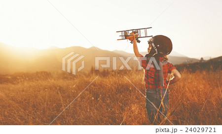 happy child dreams of traveling and playing with an airplane pil happy child dreams of traveling and playing with an airplane pil 24029721