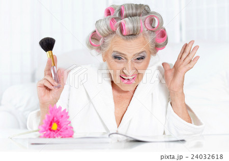 Senior woman in hair rollers Senior woman in hair rollers 24032618