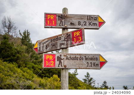 Hiking routes wooden road sigh in the mountains of 24034090