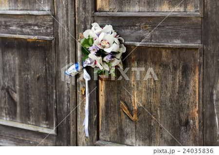 Wedding bouquet on a grey wooden doors Wedding bouquet on a grey wooden doors 24035836