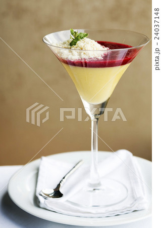 Desserts - Panna Cotta in cocktail glass on table 24037148