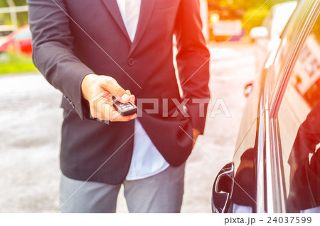 Men's hand presses on the remote control car 24037599