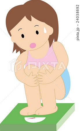 体重計に乗る女性 24038692