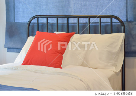 Modern bedroom with pillows and blue roman blind Modern bedroom with pillows and blue roman blind 24039638