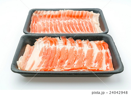 Slide of raw pork on white background . Slide of raw pork on white background . 24042948