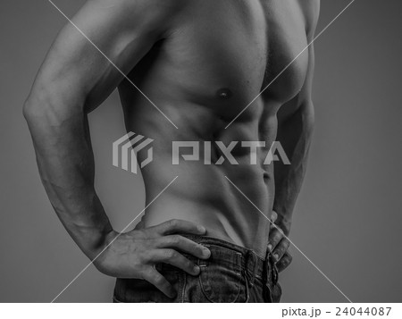Perfectly fit shirtless young man 24044087