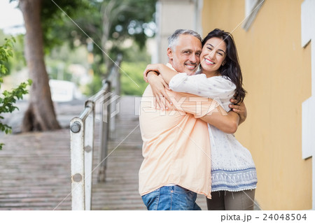 Portrait of happy couple embracing Portrait of happy couple embracing 24048504