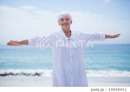 Portrait of senior woman smiling while exercising 24049451