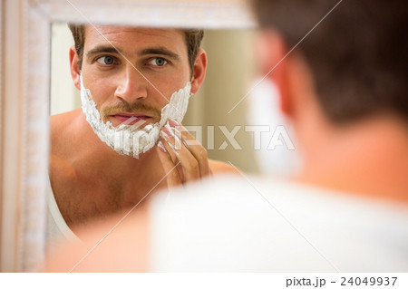 Man applying shaving foam Man applying shaving foam 24049937