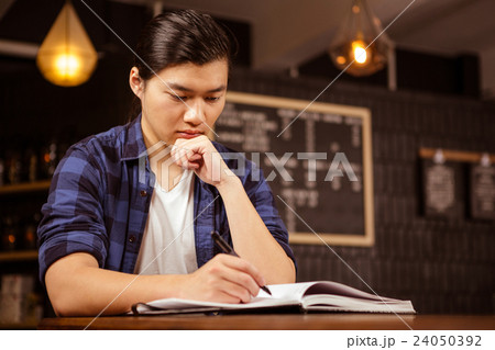 Hipster man using planner Hipster man using planner 24050392