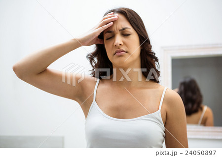 Young woman getting a headache Young woman getting a headache 24050897