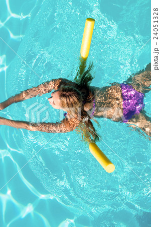 Woman swimming in swimming pool Woman swimming in swimming pool 24051328