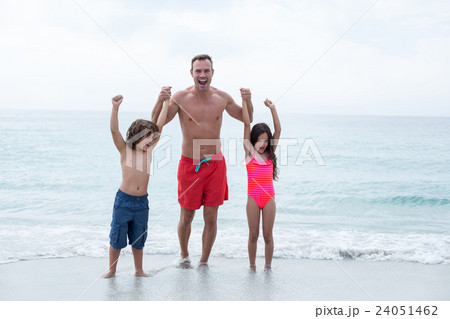 Happy father with children enjoying at beach Happy father with children enjoying at beach 24051462