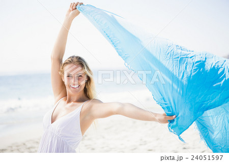 Blonde woman relaxing on the beach Blonde woman relaxing on the beach 24051597