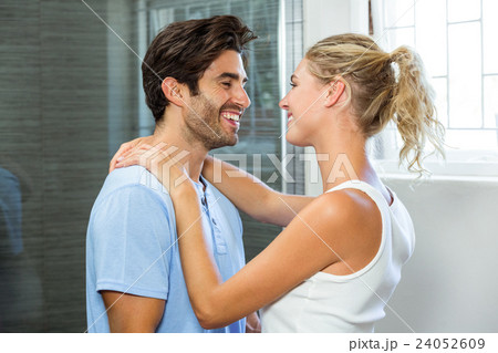 Young couple embracing in bathroom Young couple embracing in bathroom 24052609