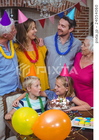 Smiling multi generation family celebrating birthday Smiling multi generation family celebrating birthday 24054060