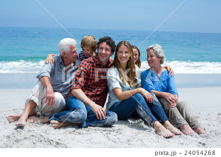 Multi-generation family smiling relaxing at sea shore 24054268