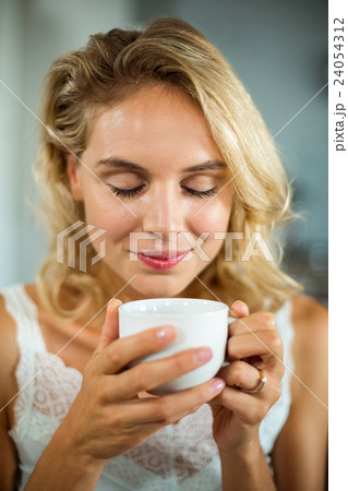 Close-up of woman having coffee 24054312