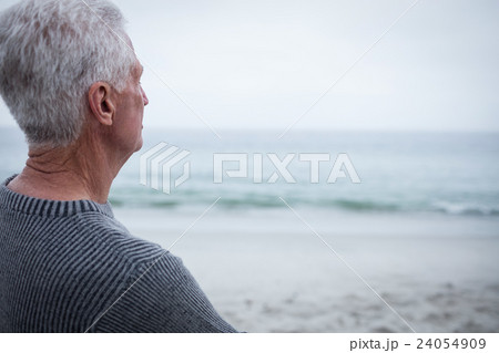Senior man looking at sea Senior man looking at sea 24054909