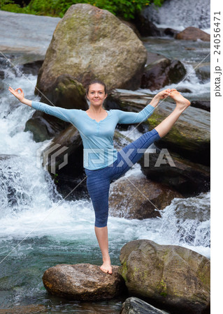 Woman doing Ashtanga Vinyasa Yoga asana outdoors Woman doing Ashtanga Vinyasa Yoga asana outdoors 24056471