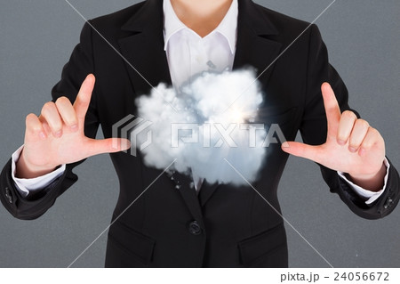 Composite image of a business man with a cloud Composite image of a business man with a cloud 24056672